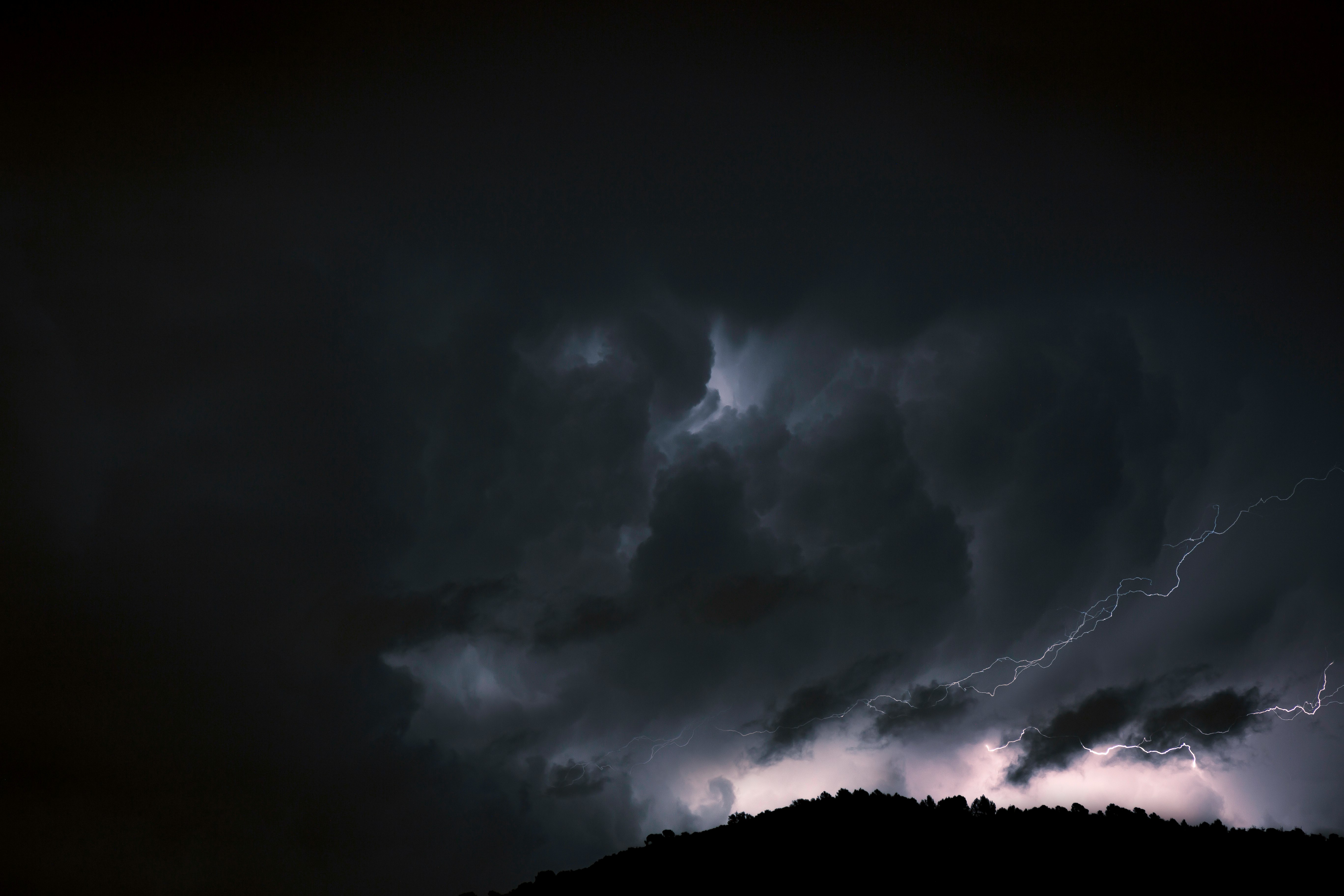 white clouds on black sky